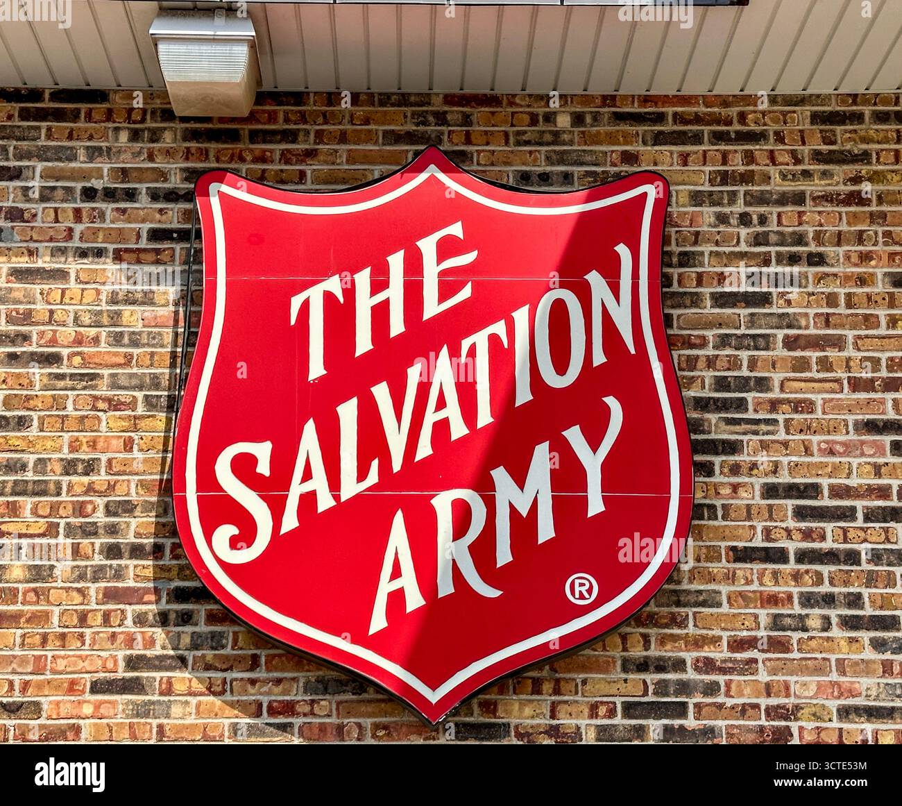 Red Salvation Army sign on the outside of a store - Smartphone Captured Stock Image