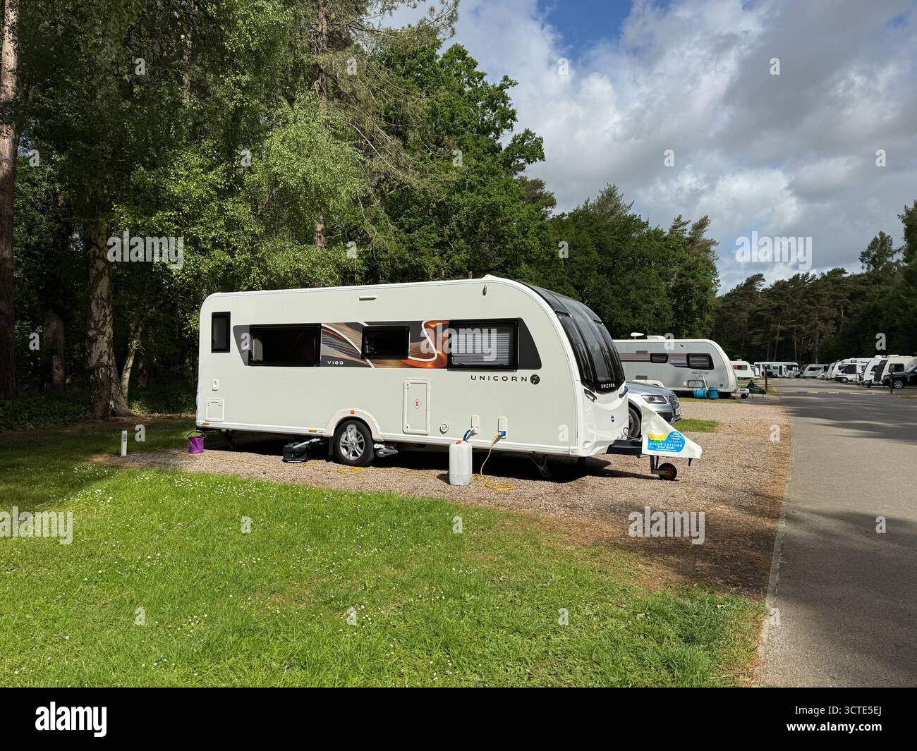 Bailey Unicorn Vigo caravan pitched at Thetford Forest Club Site, a Caravan and Motorhome Club campsite near Mundford, Norfolk, England. - Smartphone Captured Stock Image