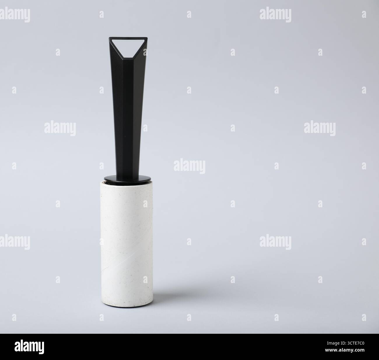 One lint roller on light grey background, space for text Stock Photo