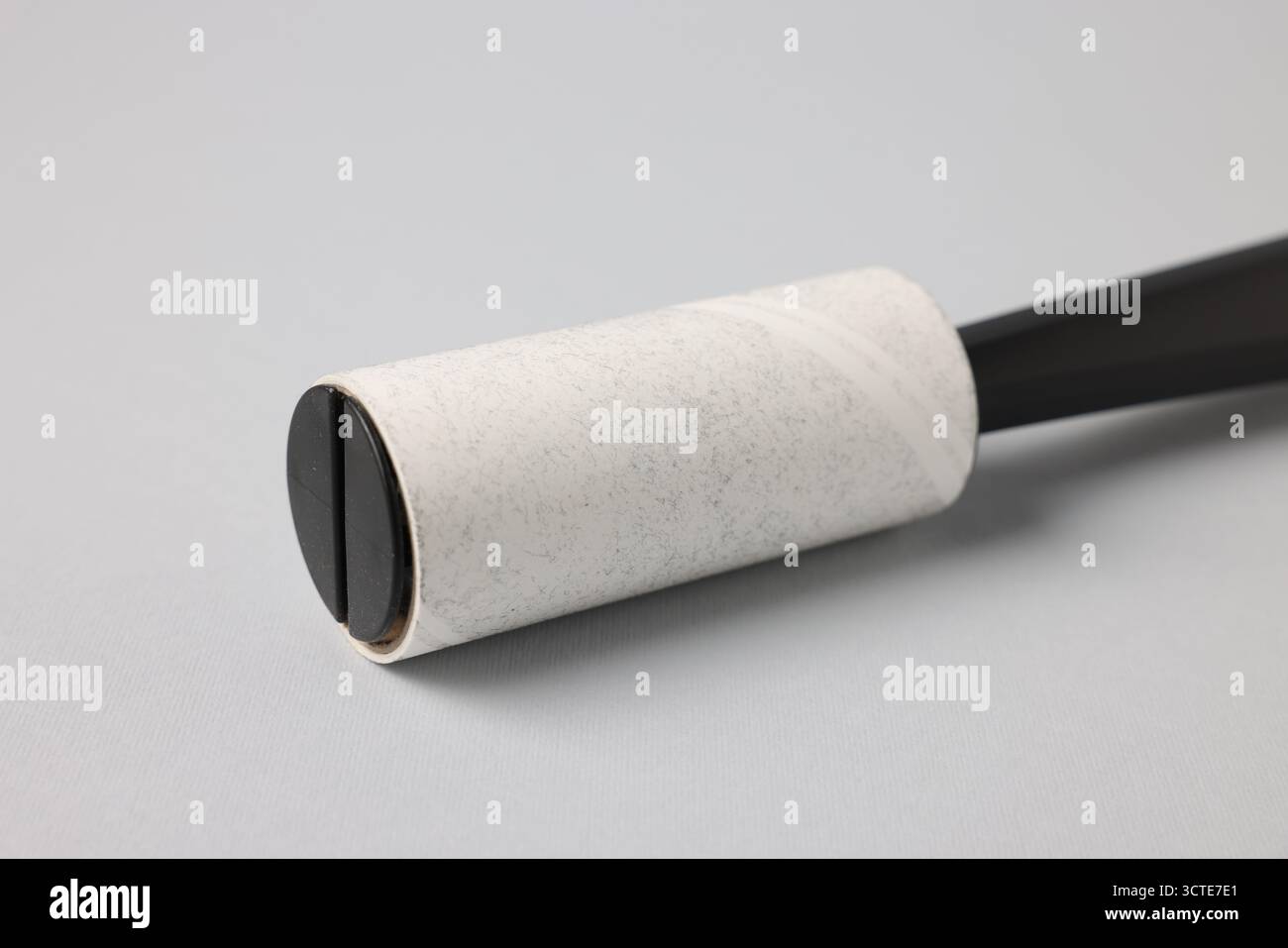 One lint roller on light grey background, closeup Stock Photo