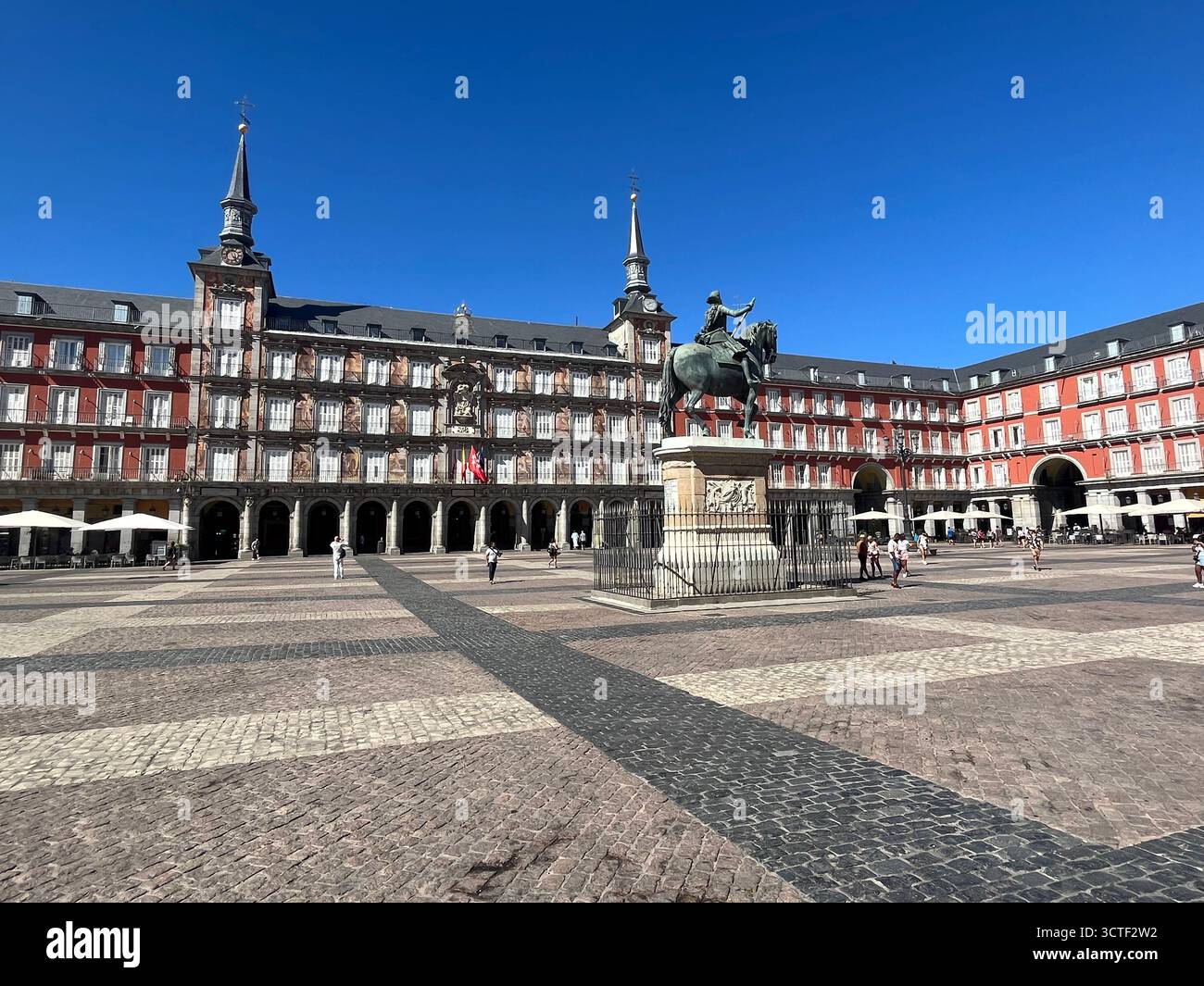 Plaza Mayor in Madrid, Spain, historic square surrounded by traditional architecture under a bright sunny summer sky in the heart of the city. - Smartphone Captured Stock Image