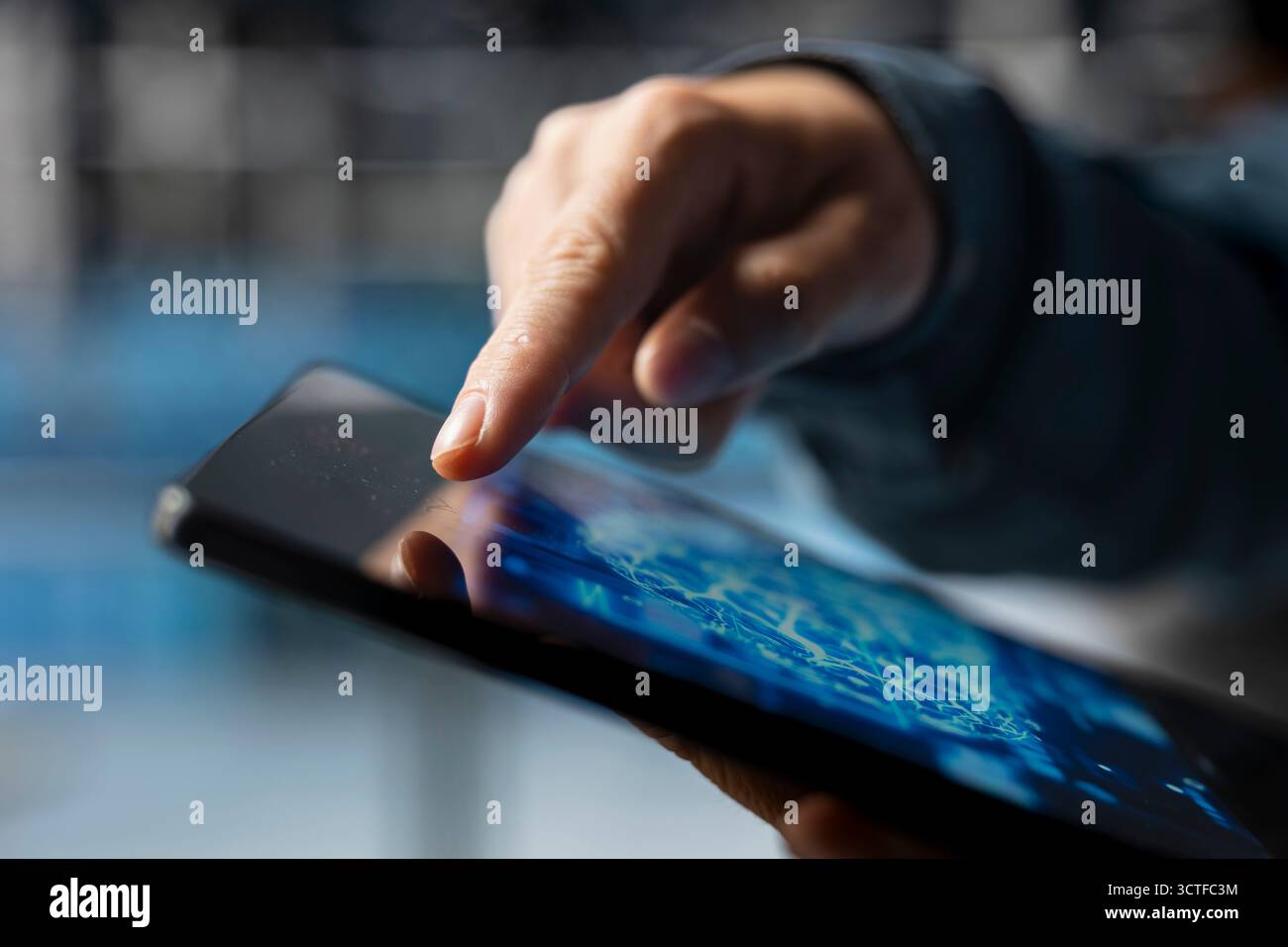 Extreme close up of data center developer using device to do AI algorithms improvements. Programmer in server hub using tablet, maintaining databases supporting AI driven applications. Stock Photo