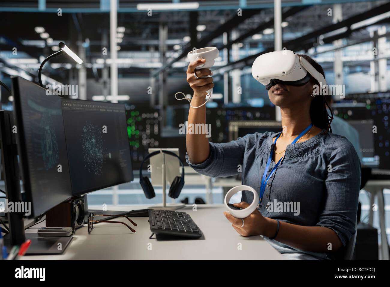 Data center worker wearing VR equipment using artificial intelligence neural networks technology. Server farm admin using virtual reality headset and AI programming language to configure hardware Stock Photo