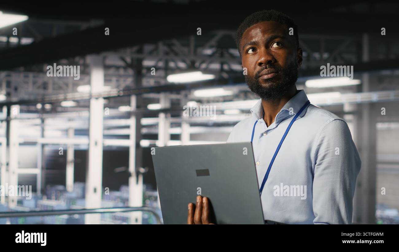 Engineers in data center using laptop to monitor neural network LLM ...