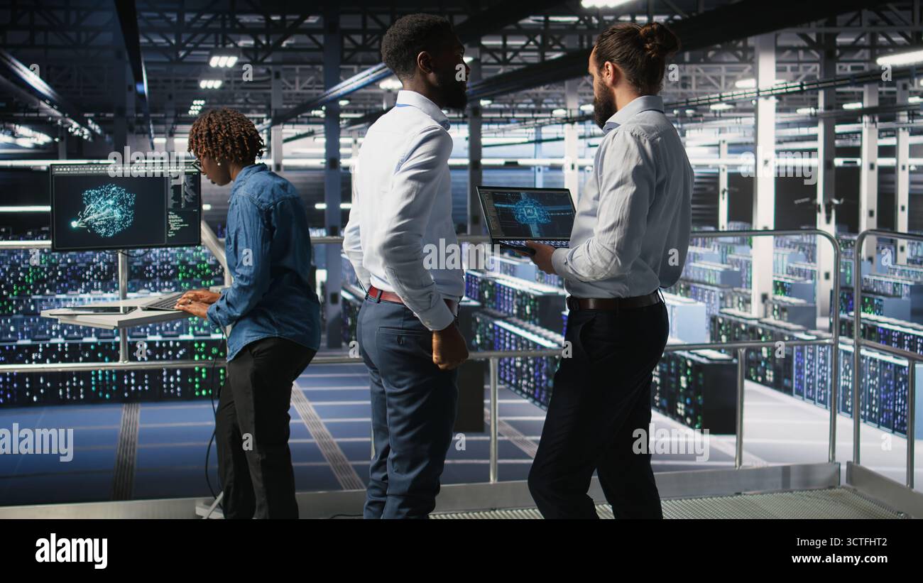 Server farm coworkers doing infrastructure AI machine learning automatization. Data center computer scientists collaborating to maintain servers using artificial intelligence, Stock Photo