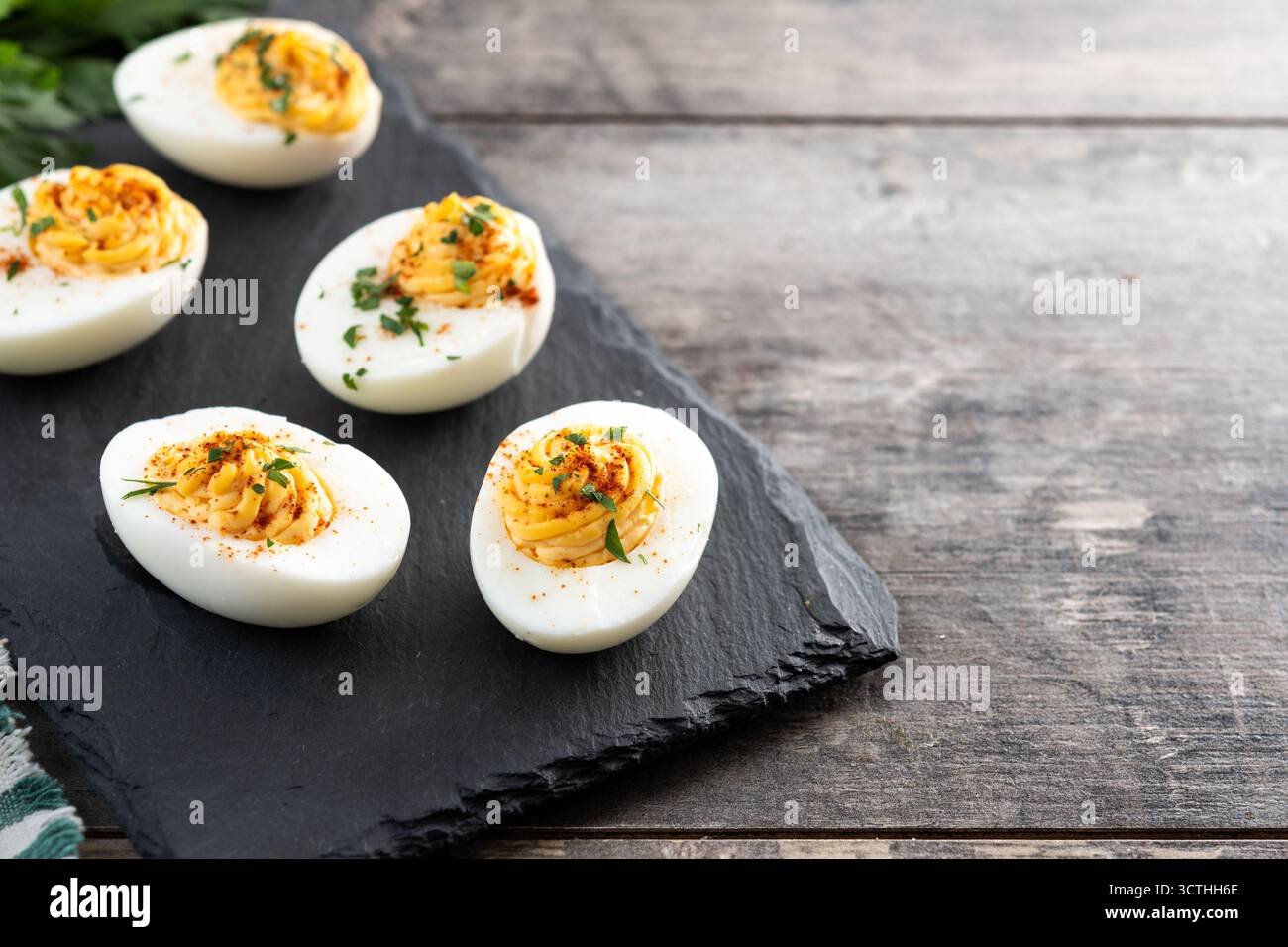 Homemade deviled eggs on wooden table Stock Photo