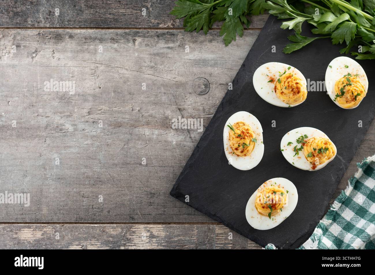 Homemade deviled eggs on wooden table Stock Photo
