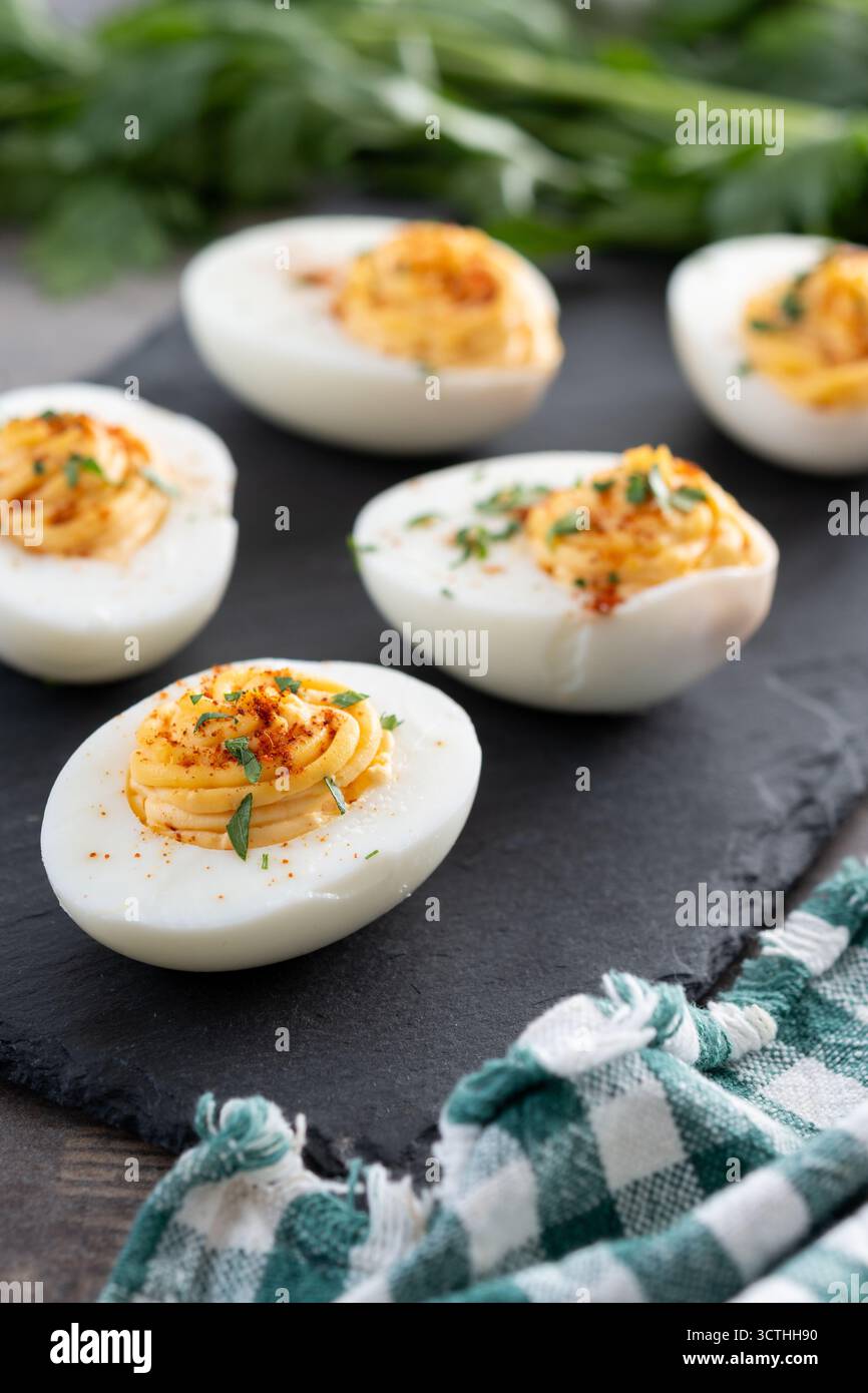 Homemade deviled eggs on wooden table Stock Photo