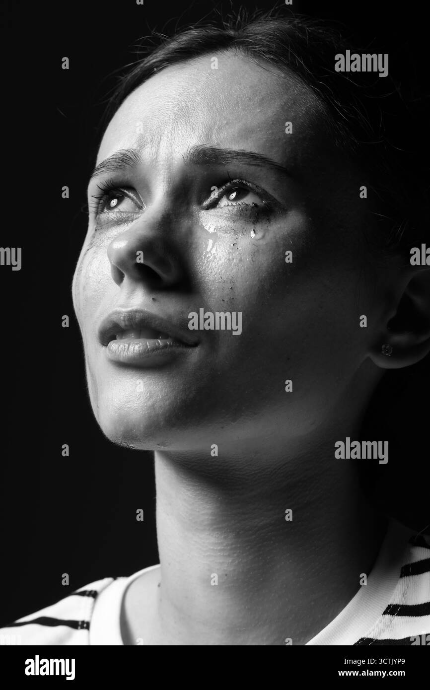 Sad woman crying on dark background. Black and white effect Stock Photo ...