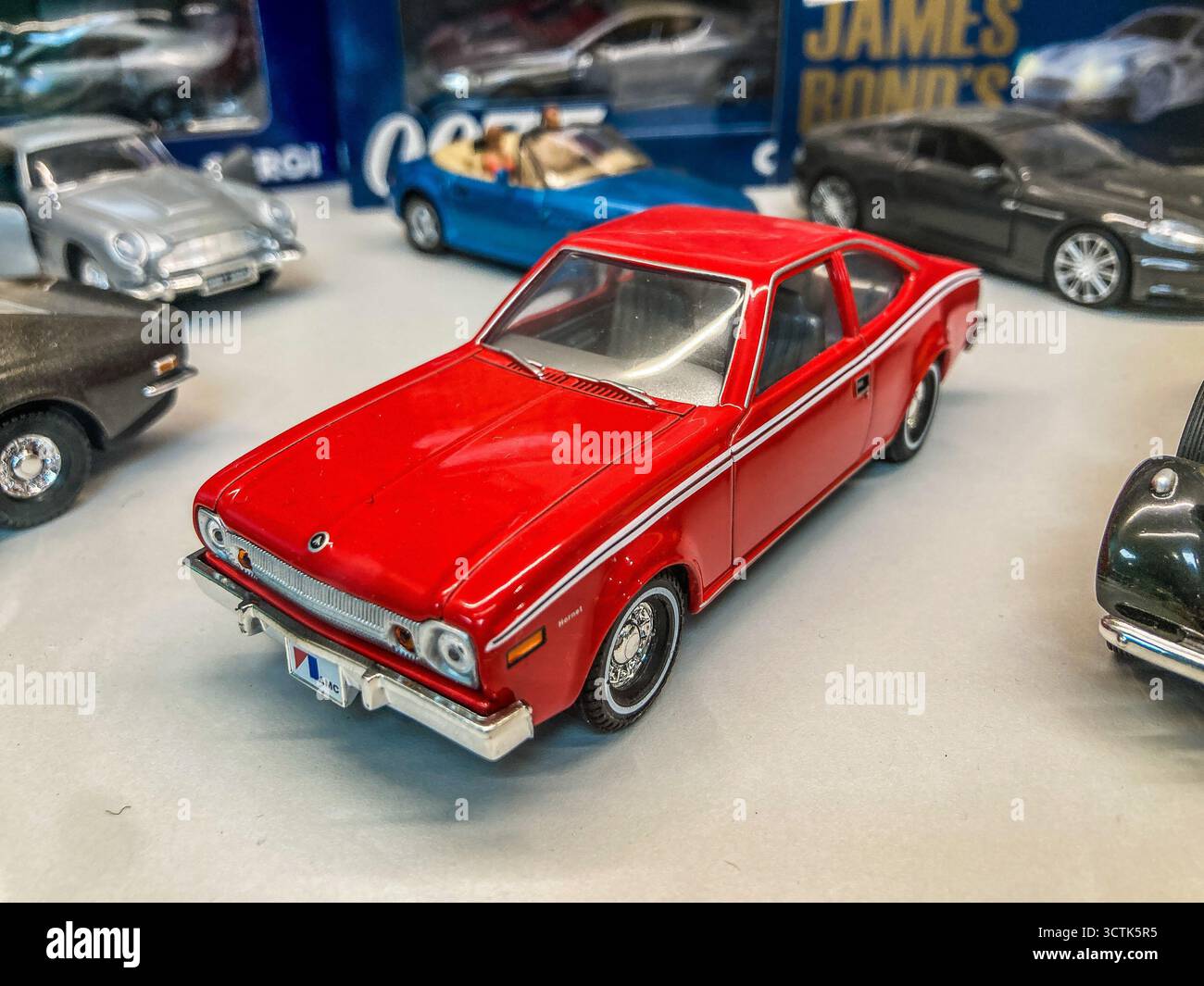 A diecast, Corgi model of a Red,  AMC  Hornet,  which featured in  The Man with the Golden Gun, on display at Wonderworks, Margate, Kent - Smartphone Captured Stock Image