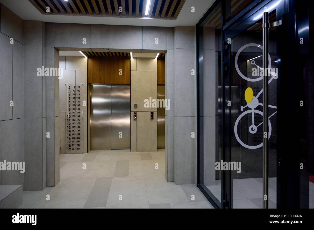 Interior of the lobby with metal elevators. A modern elevator hall of a ...