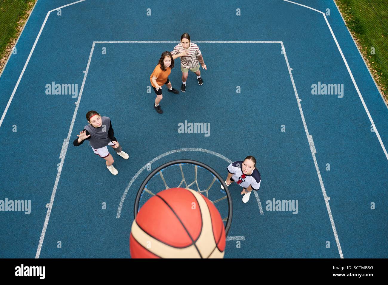 Yball Group of four teenagers, including two Caucasian girls, one Black girl ...