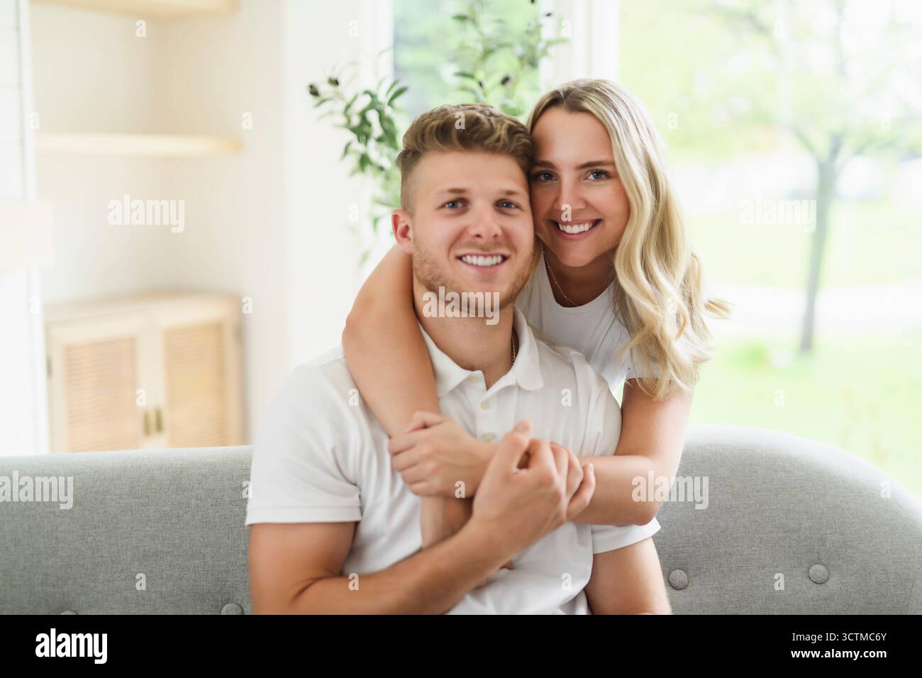 lovely young couple relaxing on the sofa at home Stock Photo
