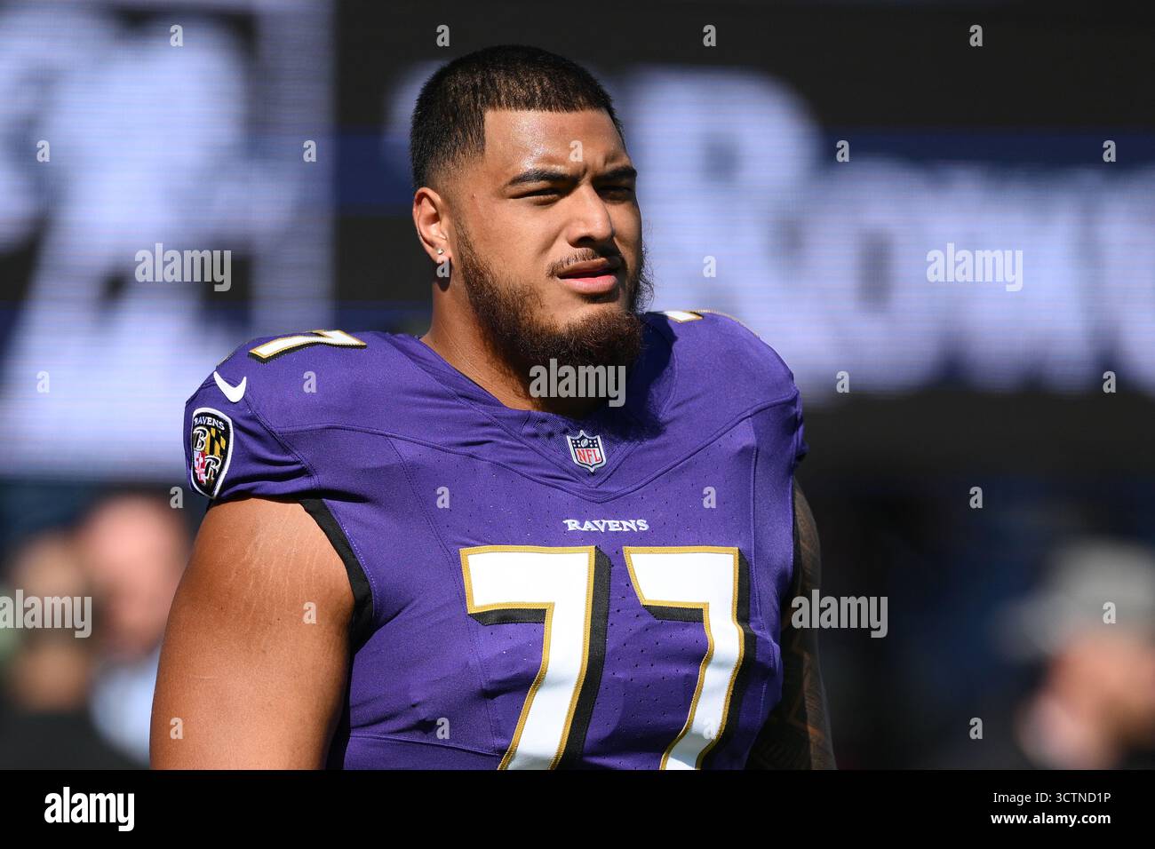 Baltimore Ravens guard Daniel Faalele (77) warms up before an NFL ...