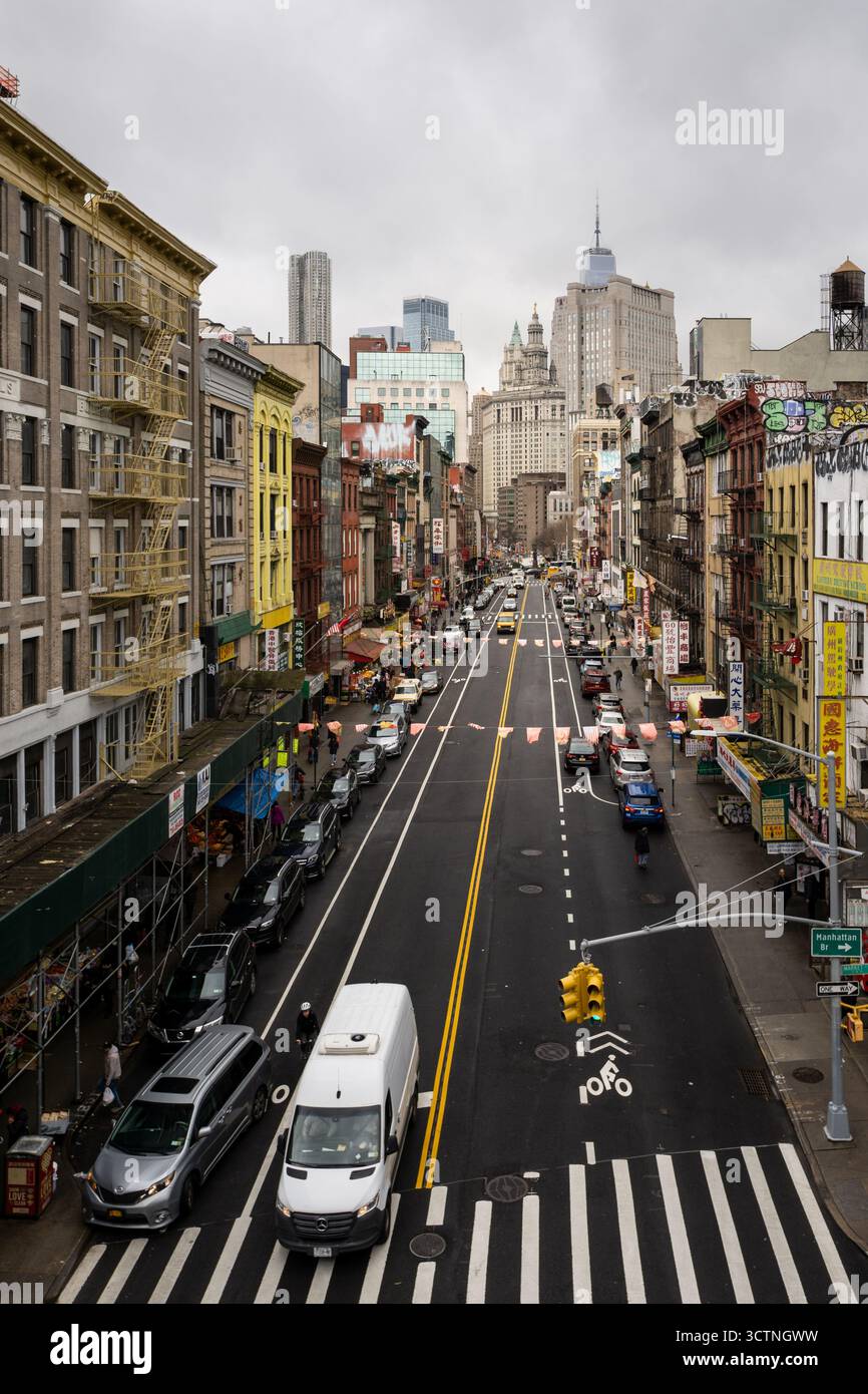 A bustling urban street scene with cars and pedestrians in a city Stock ...