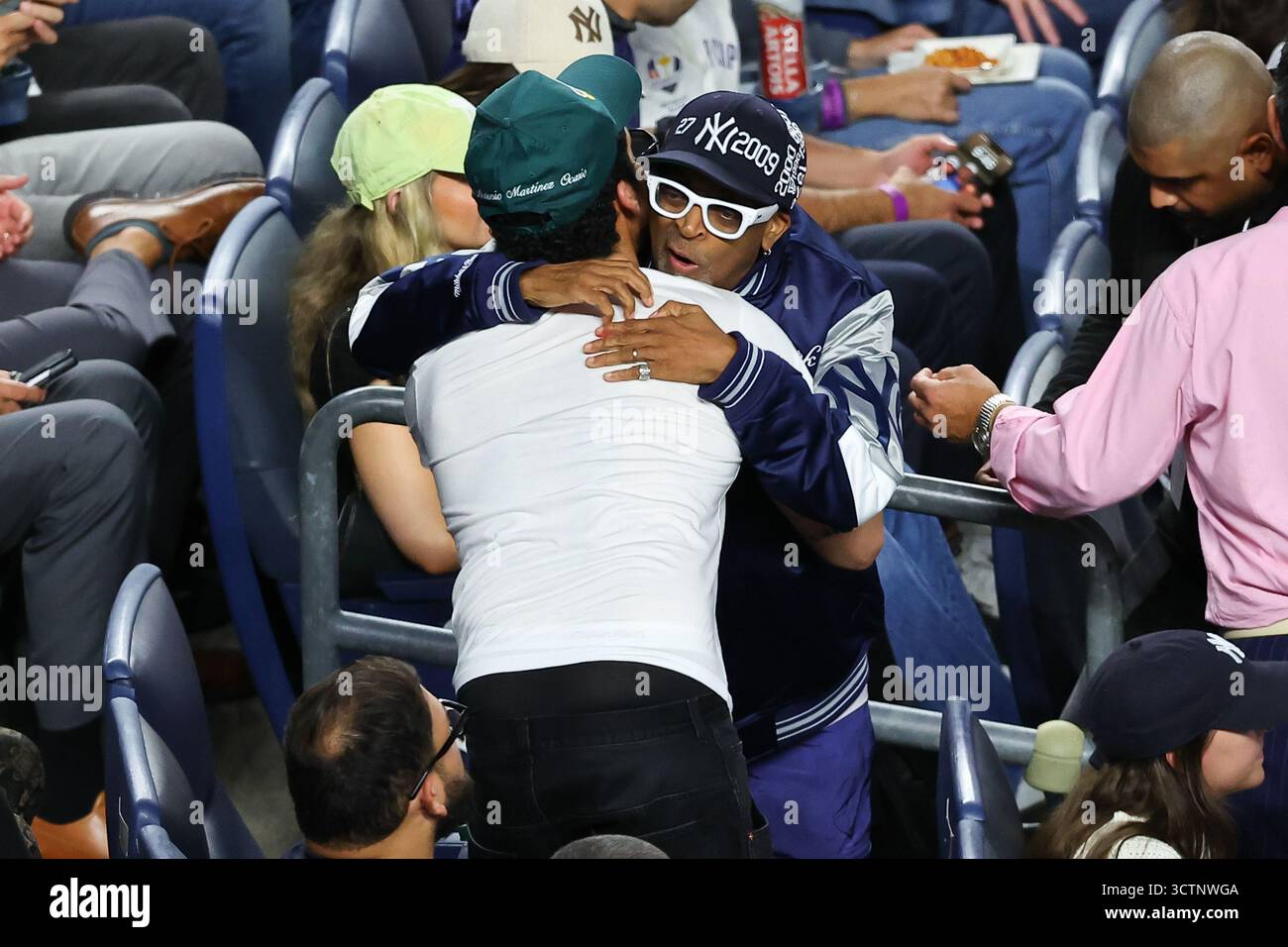 BRONX, NY - OCTOBER 07: Spike Lee hugs Bad Bunny during the ALDS Game 3 ...