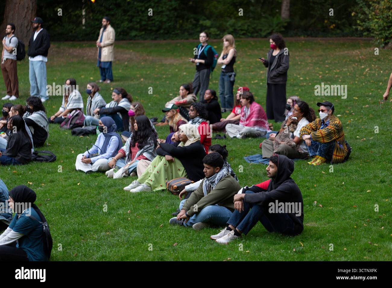 Seattle, Washington, USA. 7th October 2025. Supporters gather at a Vigil for Palestine honoring lives lost on the two-year anniversary of Hamas’ Oct. 7 attack at the University of Washington. The vigil and prayer were organized by Zaytoon UW, a Palestinian led organization at the University of Washington. Credit: Paul Christian Gordon/Alamy Live News Stock Photo