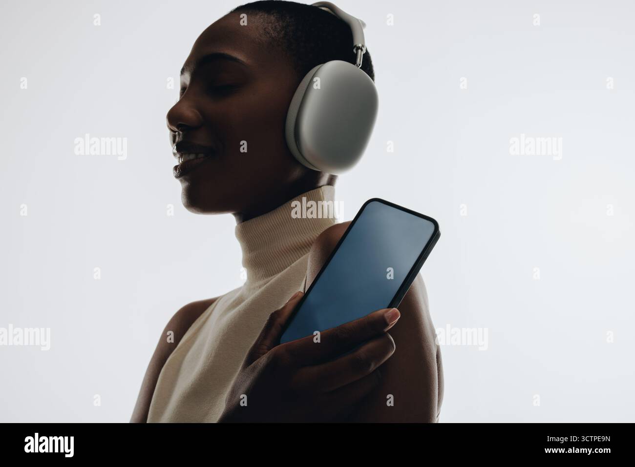 Side profile woman wearing headphones hi-res stock photography and