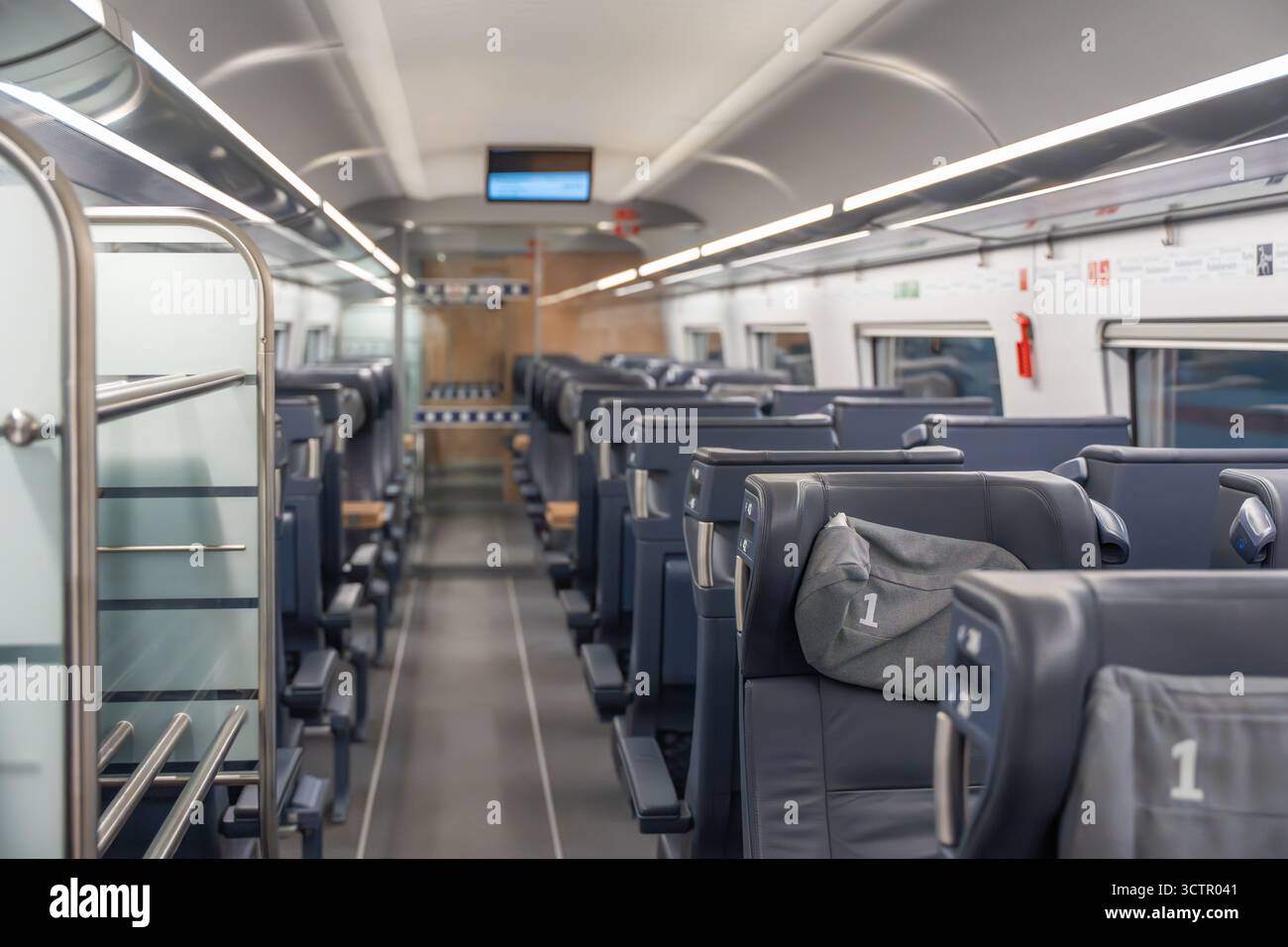 First class train interior. First-class train seats in dark leather ...