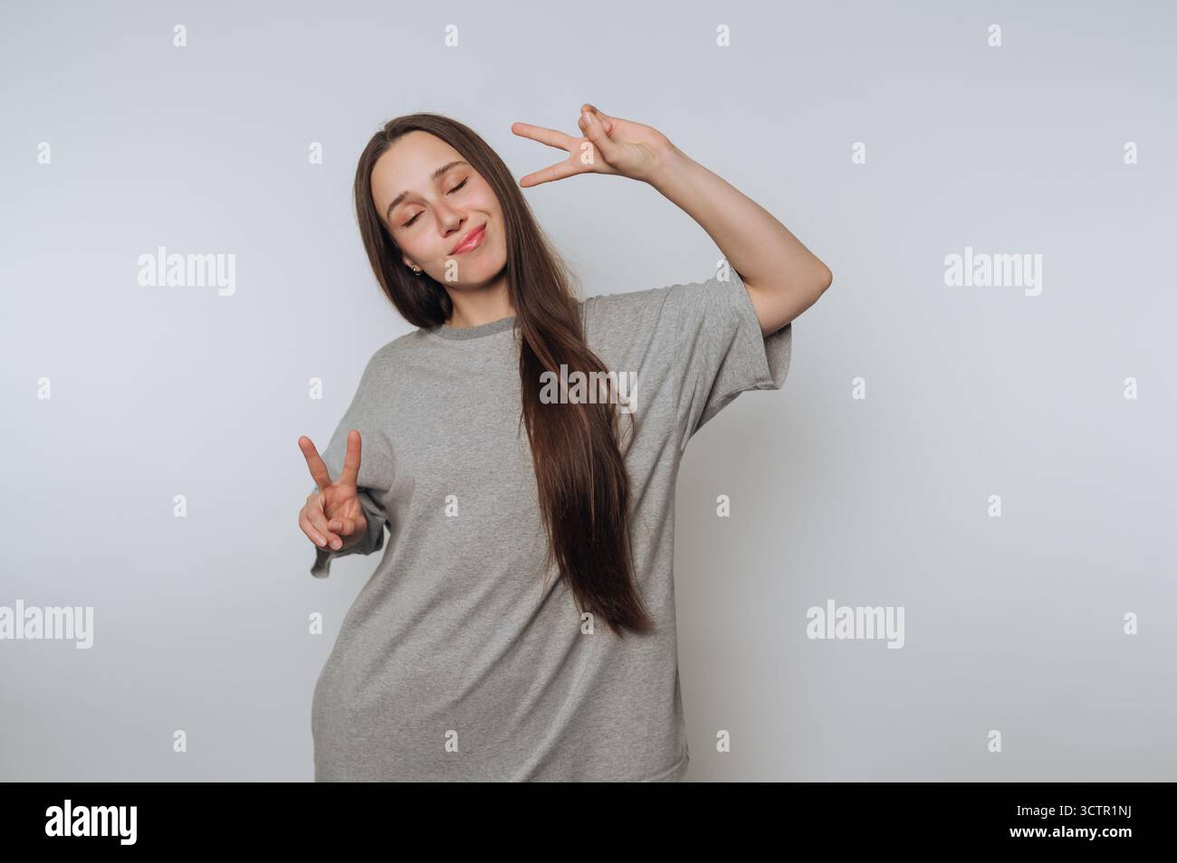 Woman making peace sign hands hi-res stock photography and images - Alamy