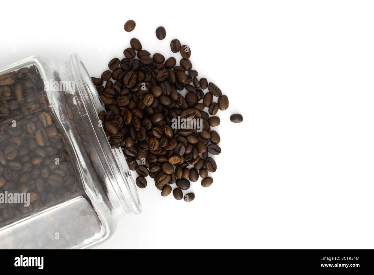 Roasted coffee beans in a glass jar Stock Photo