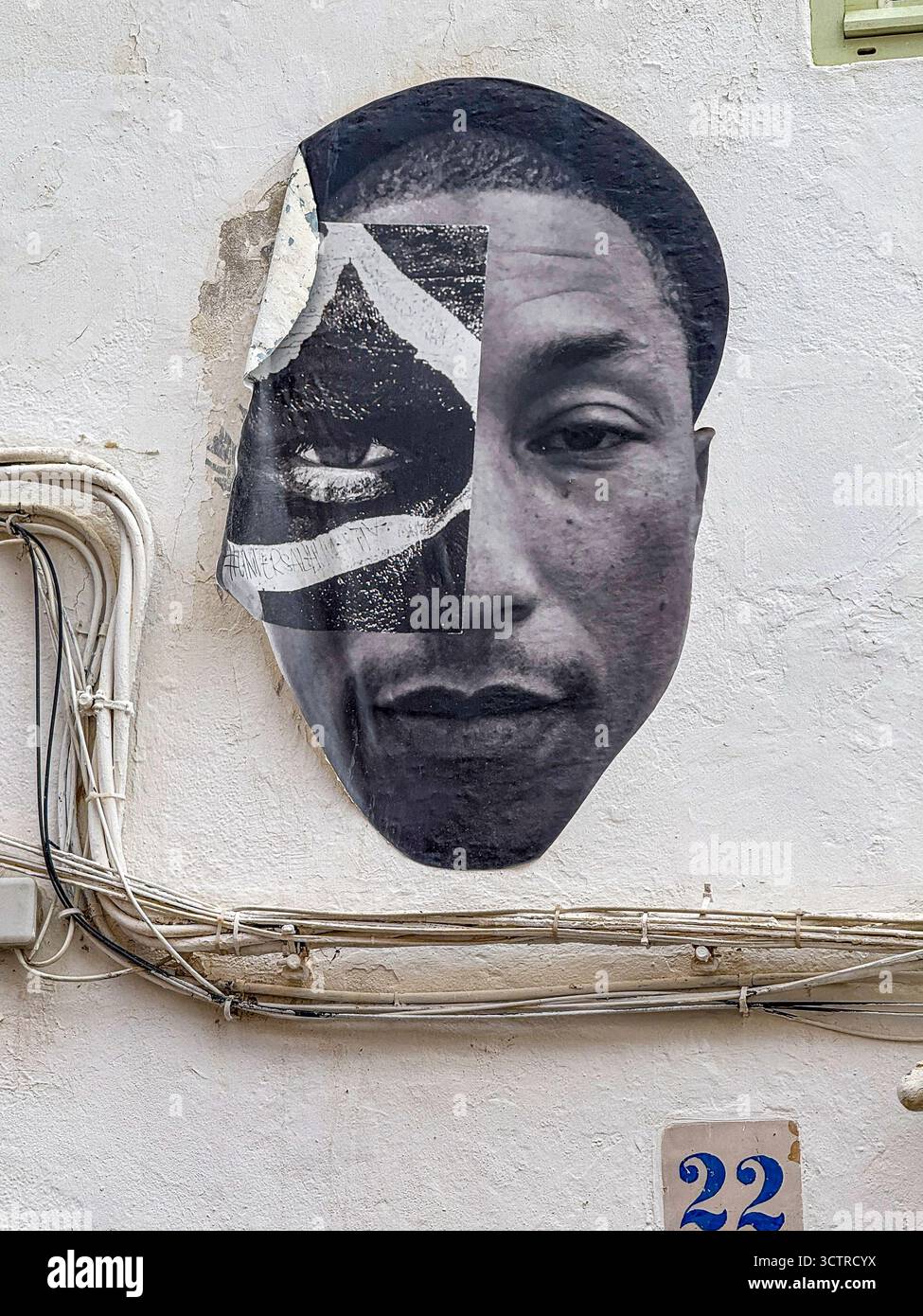 Paste-Up Street Art Portrait of Pharrell Williams on Whitewashed Wall, Dalt Vila, Ibiza, Spain: Phillip Roberts - Smartphone Captured Stock Image