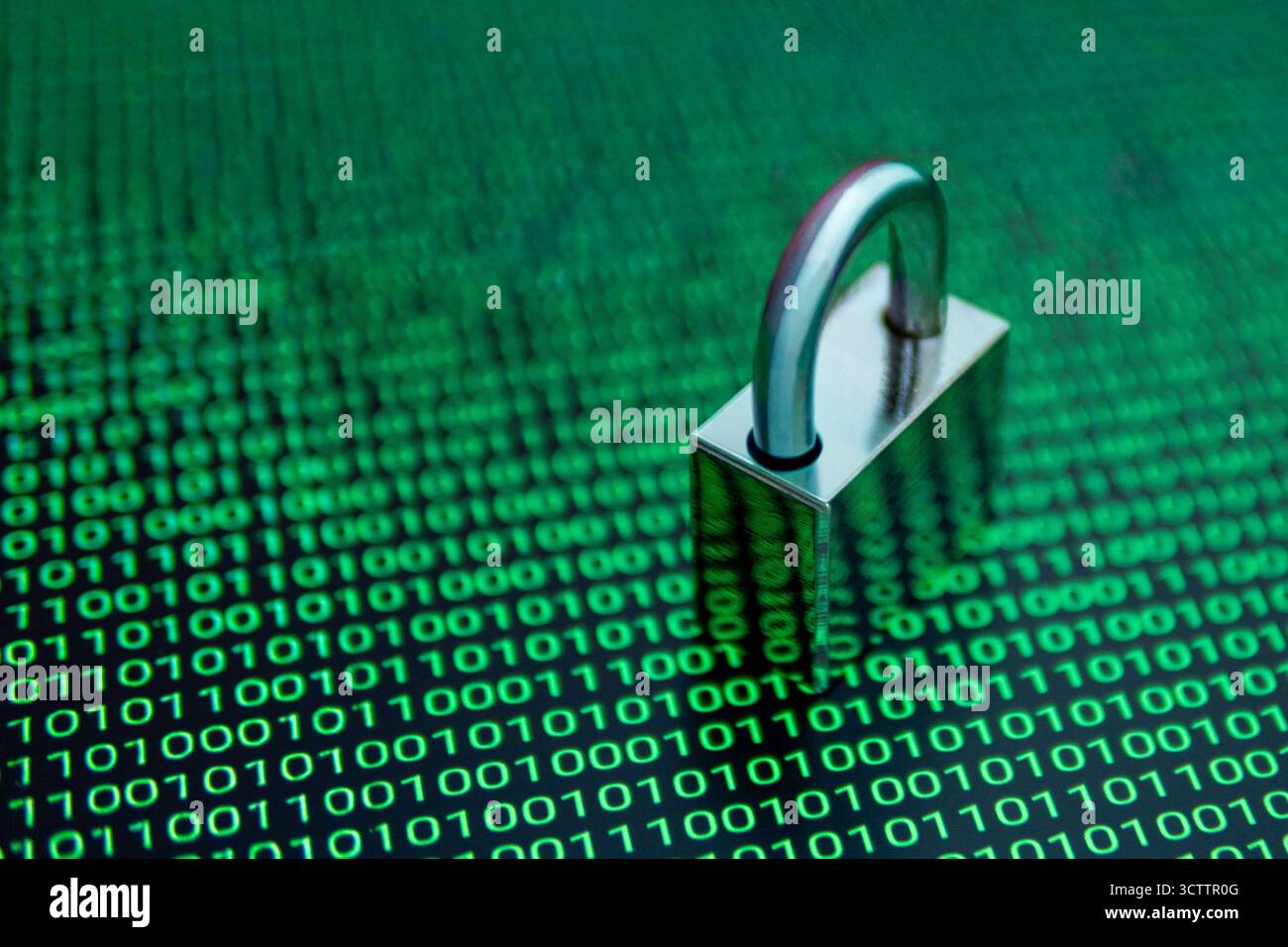 Cybersecurity concept with a padlock over binary code background, symbolizing data protection, encryption, and internet security in the digital world. Stock Photo