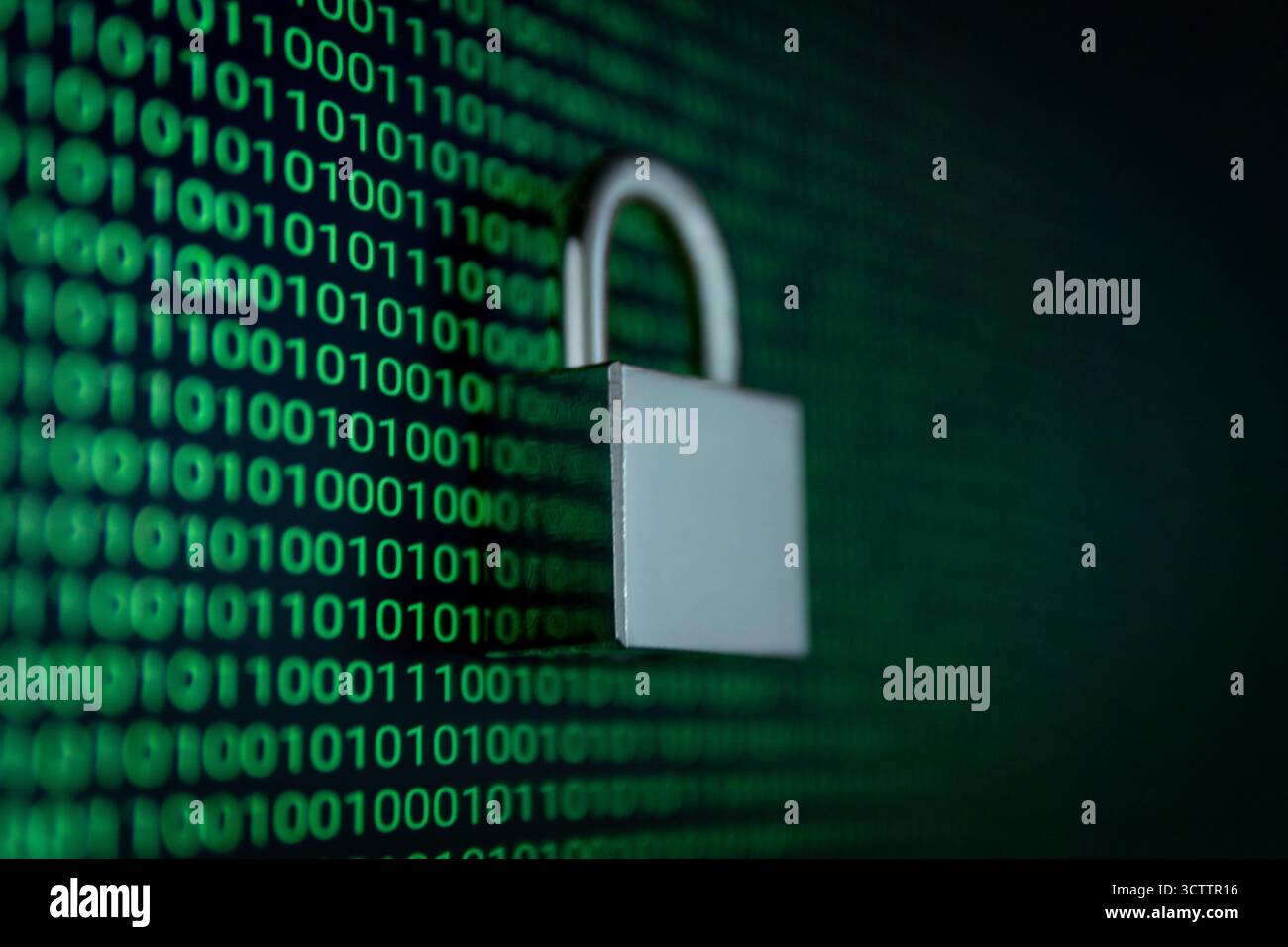 Cybersecurity concept with a padlock over binary code background, symbolizing data protection, encryption, and internet security in the digital world. Stock Photo