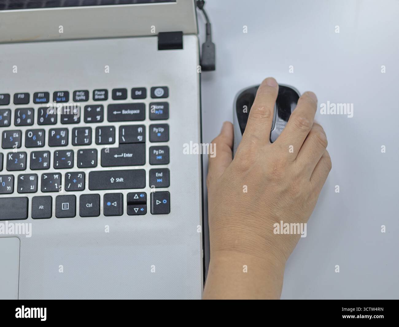Image showing hand using a wireless mouse Stock Photo