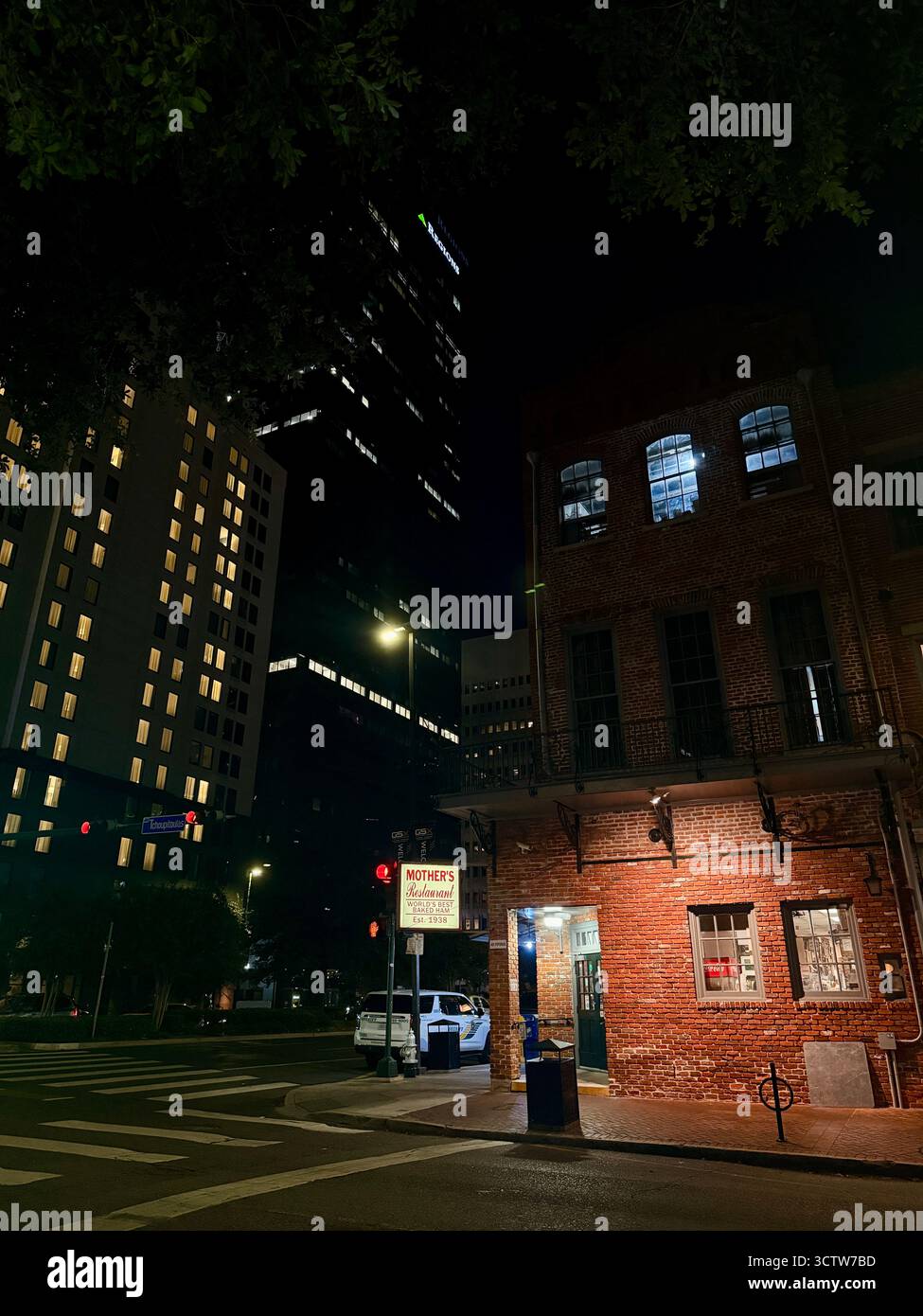 Mother’s Restaurant corner at night in downtown New Orleans - Smartphone Captured Stock Image