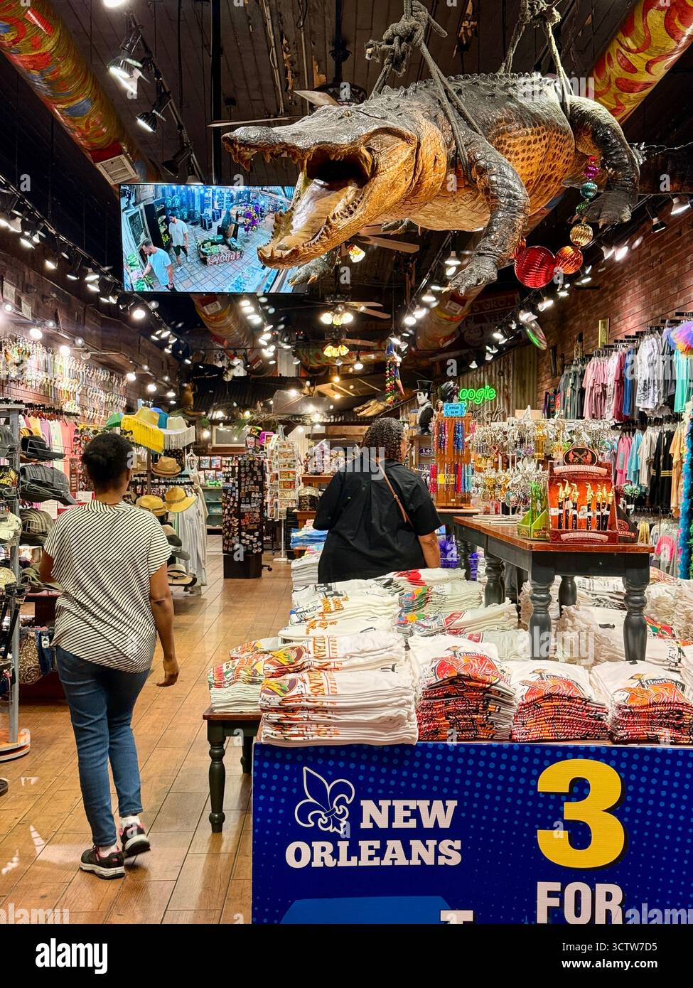 Souvenir shop interior with hanging alligator decoration in New Orleans - Smartphone Captured Stock Image