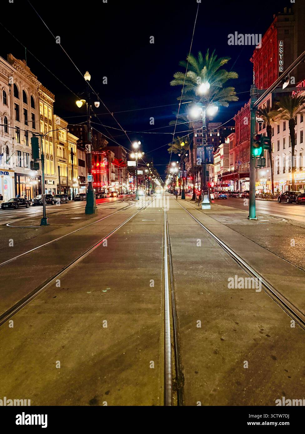 Colorful night street with neon lights and palm trees in downtown New Orleans - Smartphone Captured Stock Image
