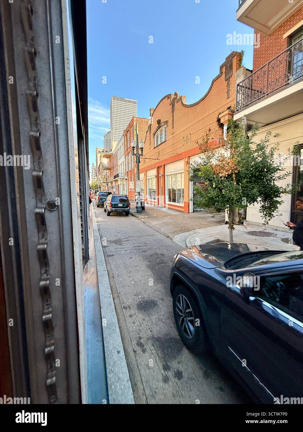Street view with historic brick buildings in downtown New Orleans - Smartphone Captured Stock Image