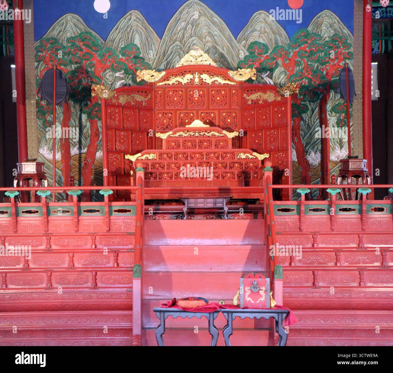 A photograph of the ornate royal throne inside the Geunjeongjeon ...