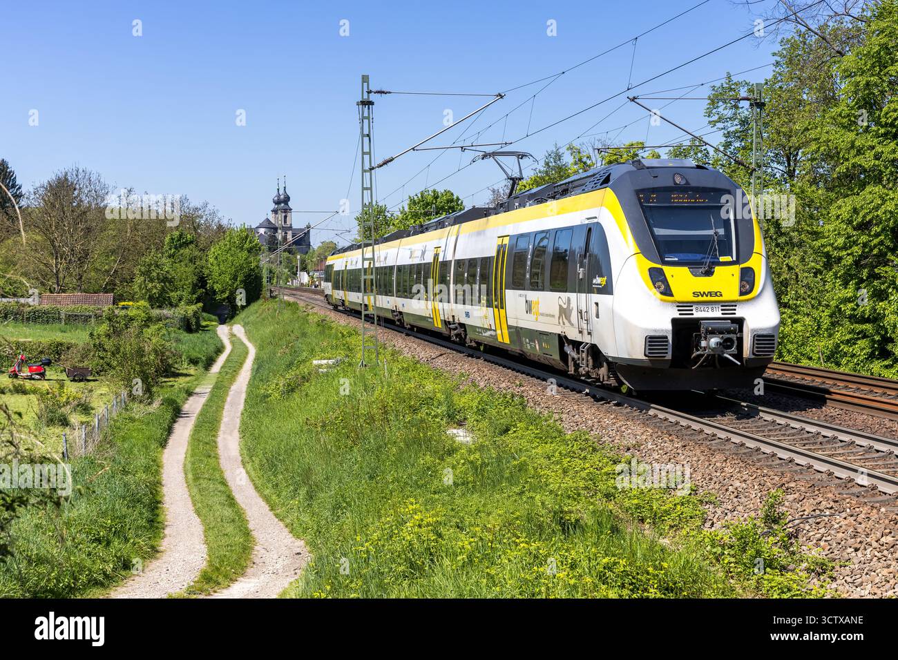 Bruchsal, Germany - April 28, 2025: Regional train of SWEG type Bombardier Talent 2 public transport in Bruchsal, Germany. Stock Photo