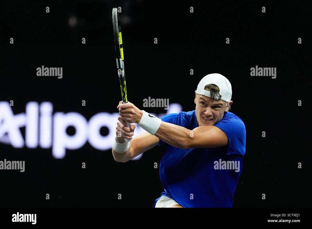 Team Europe's Holger Rune, of Denmark, returns a shot against Team ...