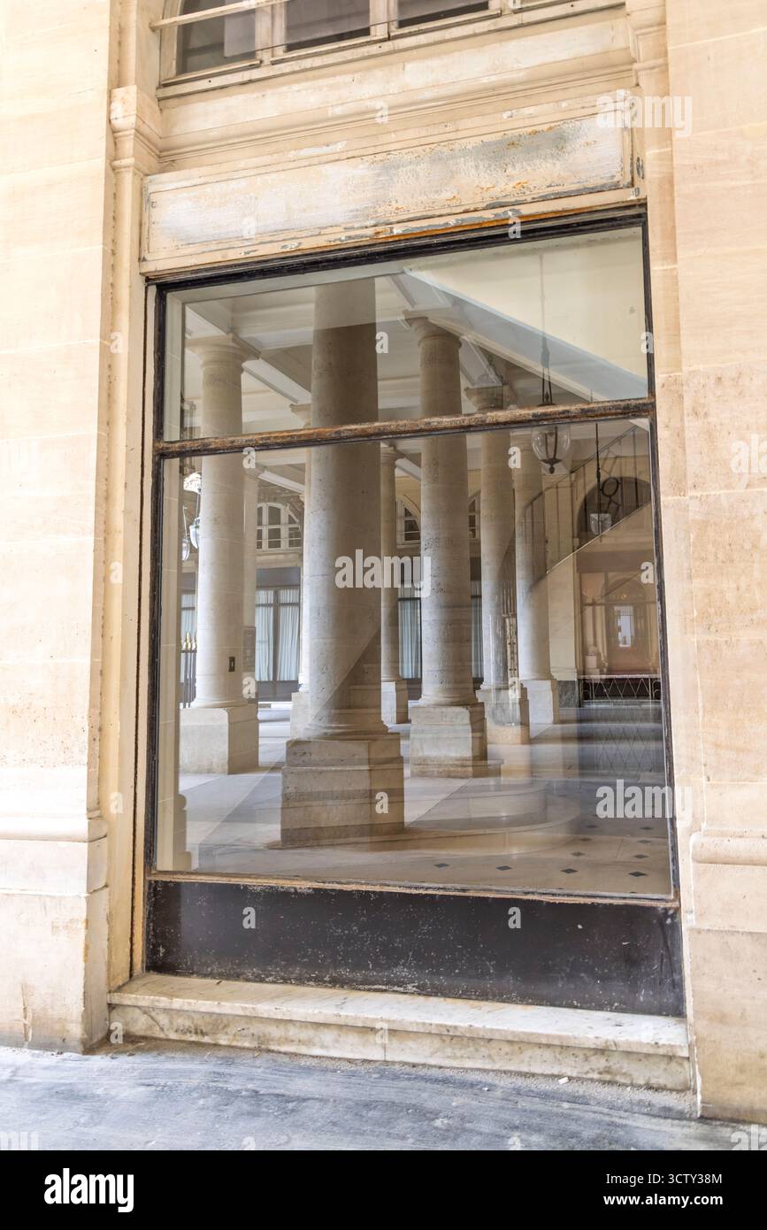 France, Paris. View of columns inside a window in the Palais Royal ...