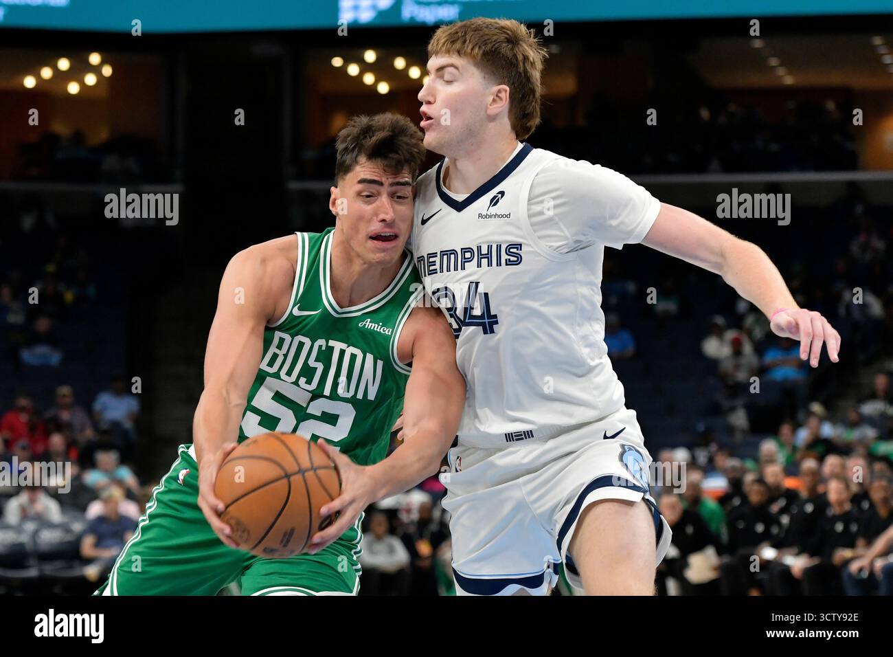 Boston Celtics center Luka Garza (52) handles the ball against Memphis