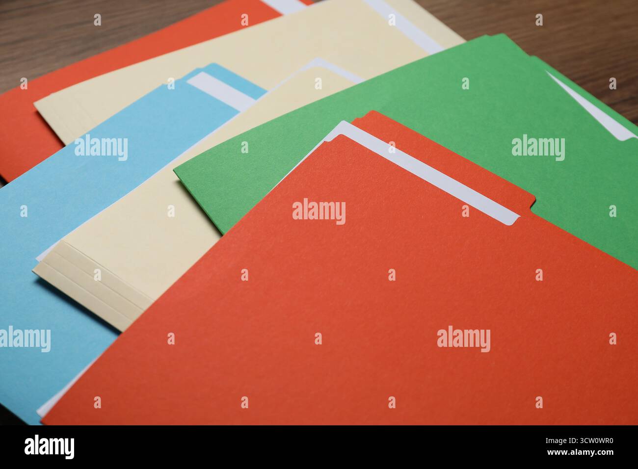 Many documents in folders on wooden table, closeup Stock Photo