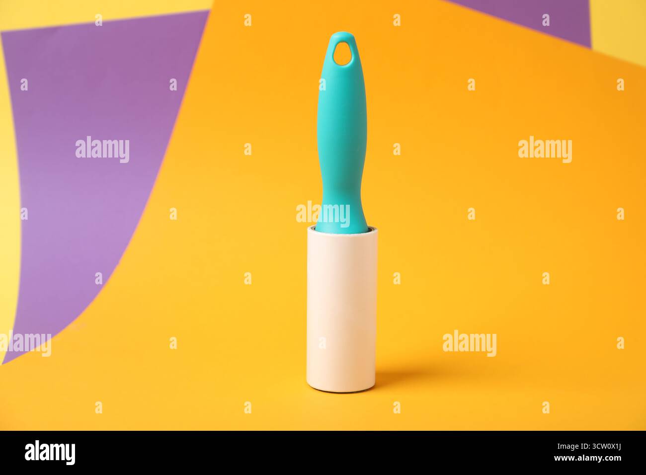 One sticky lint roller on color background Stock Photo
