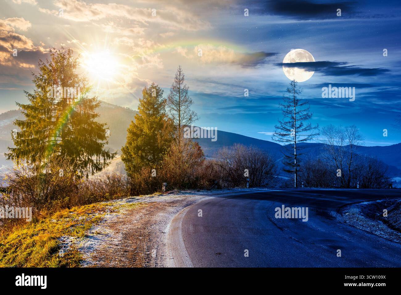country road in mountains. day and night time change concept. beautiful countryside landscape in late autumn. fir trees on the roadside with sun and m Stock Photo