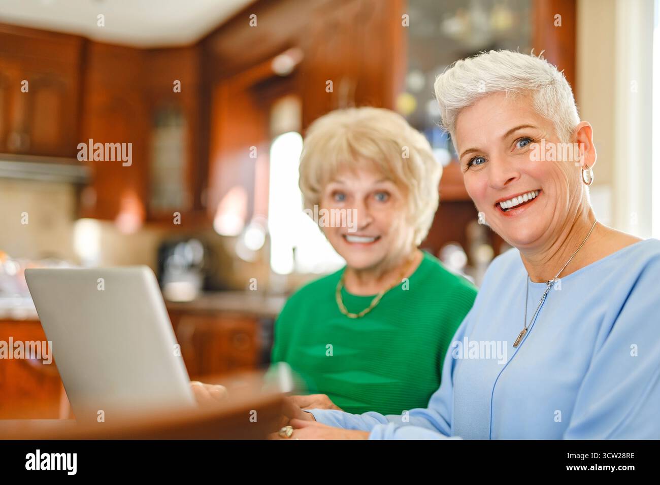 A daughter explaining some documentation to senior parent Stock Photo
