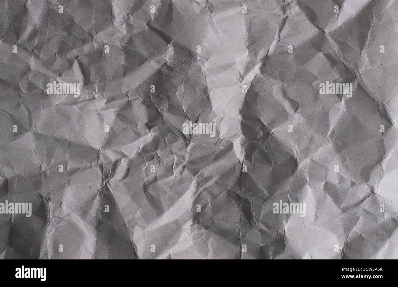 Crumpled grey paper background. Crumpled paper texture Stock Photo