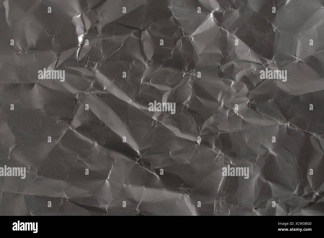 Grey crumpled paper texture. Abstract background and texture for design Stock Photo