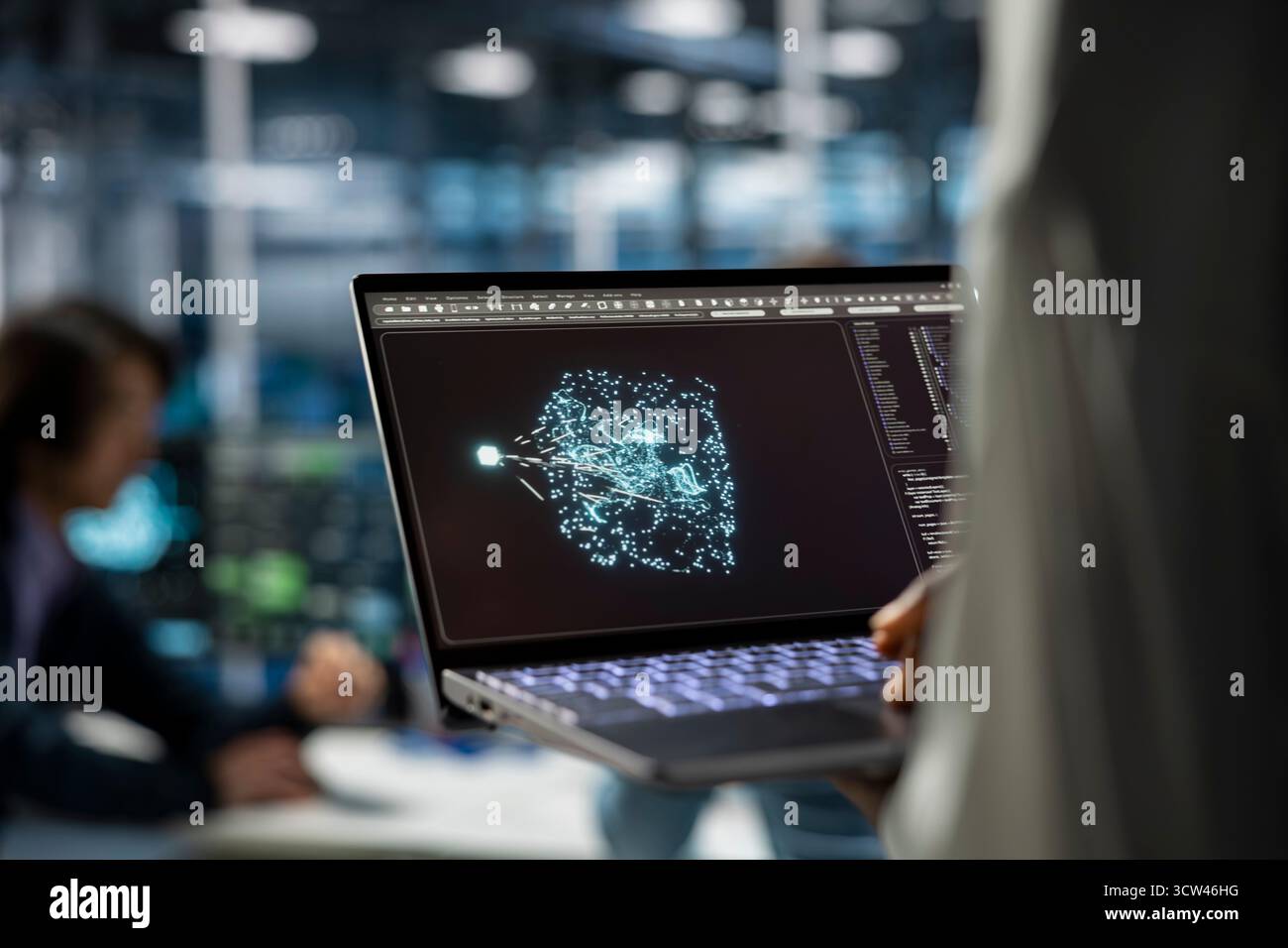 Close up of data center developer using laptop, working on databases supporting AI applications. IT professional uses notebook in server hub, doing algorithms improvements with artificial intelligence Stock Photo