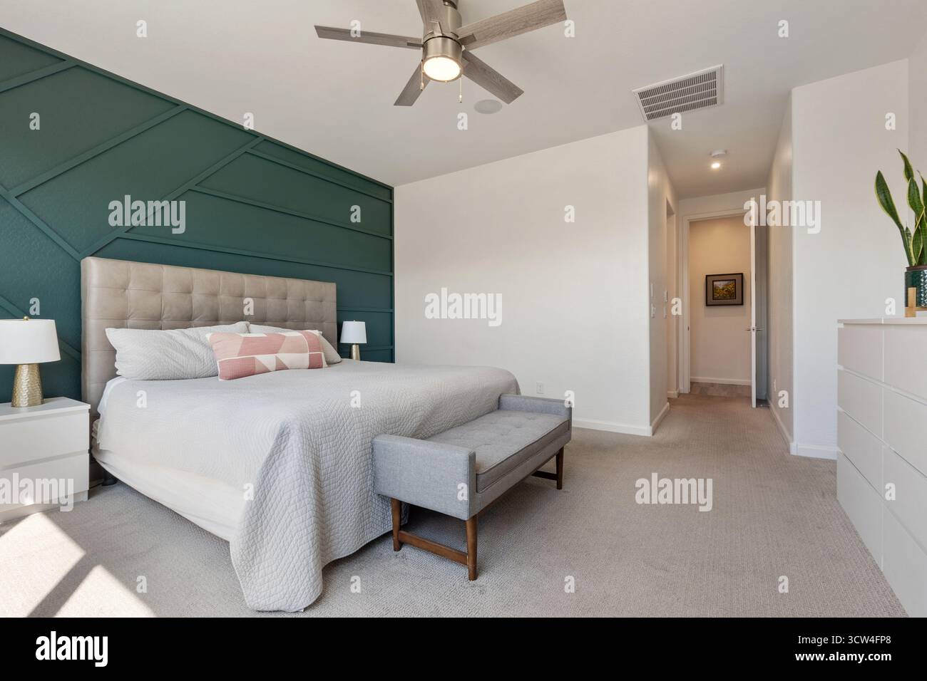 Ceiling King A beautifully designed bedroom with a king bed and ceiling fan Stock ...