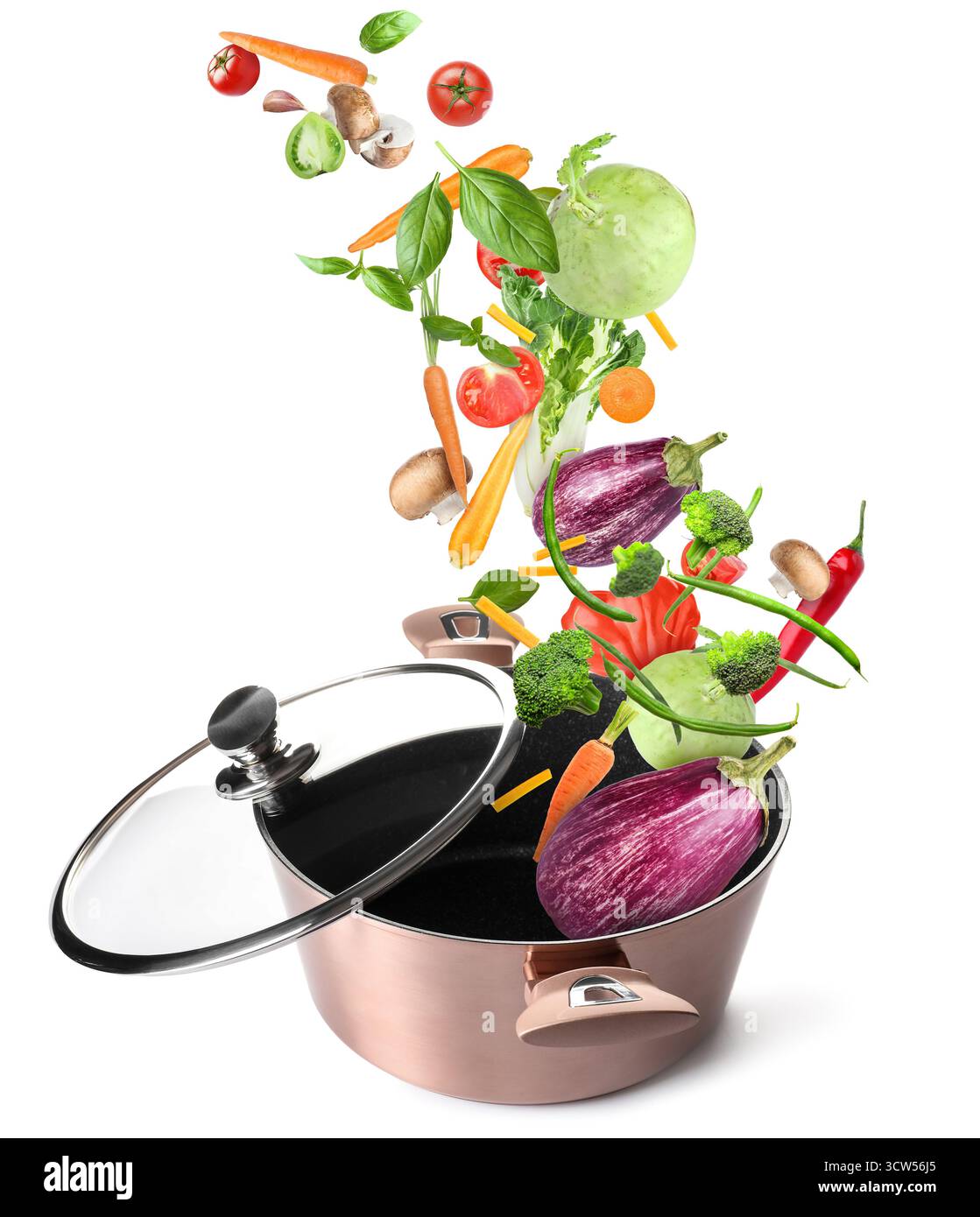 Cooking pot and different flying vegetables on white background Stock Photo