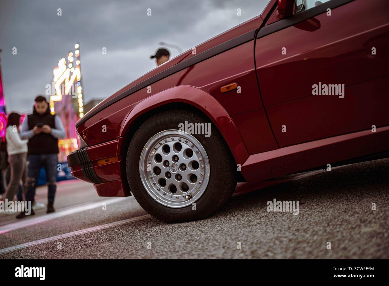 Rome, italy 10 september 2025: classic alfa romeo in deep red with ...
