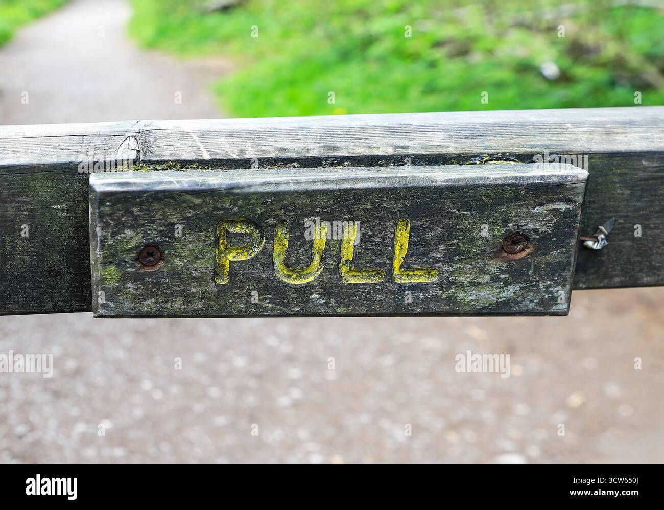 A wooden sign on a gate saying 'Pull', England, UK Stock Photo