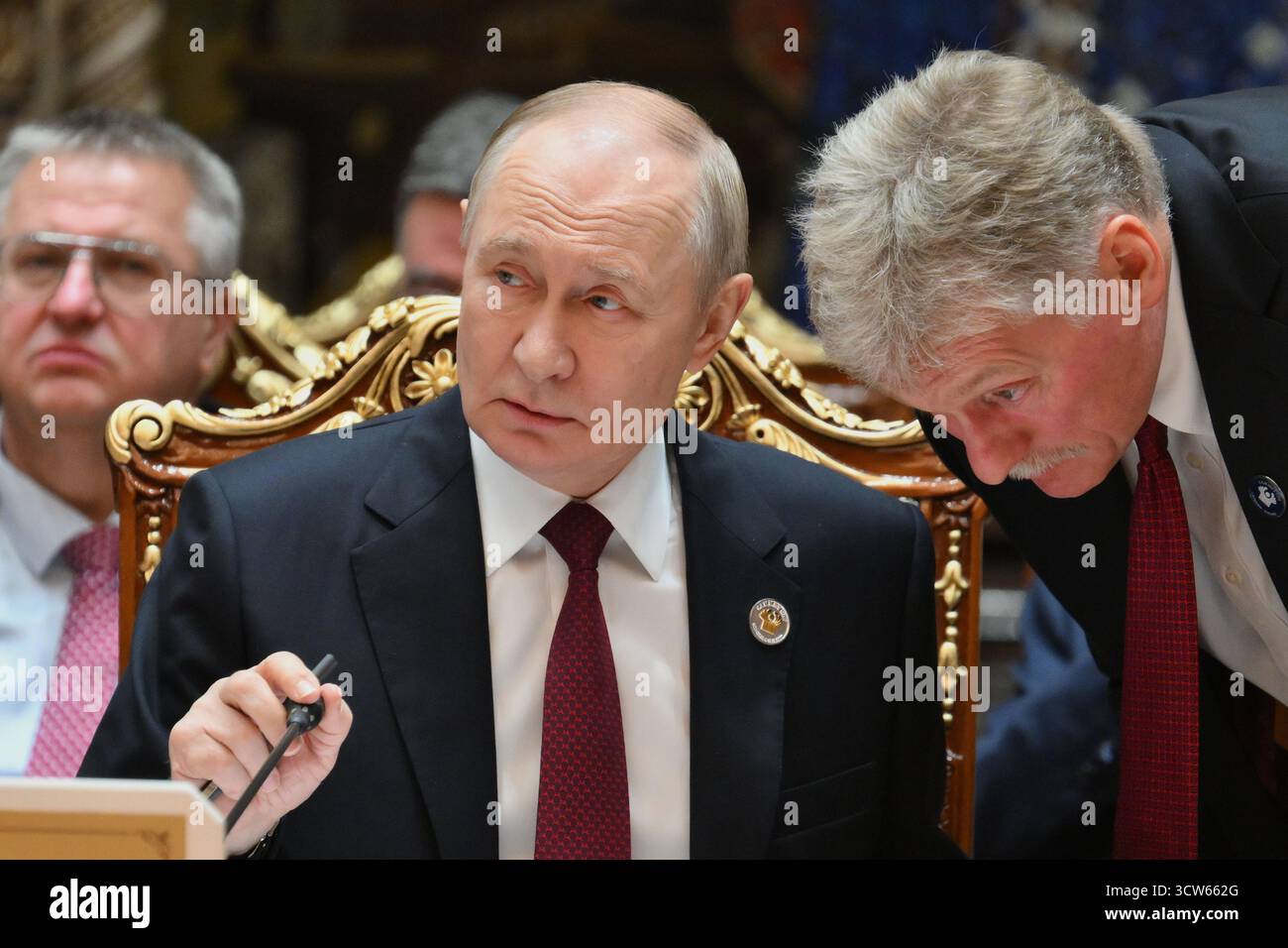 Russian President Vladimir Putin, left, speaks with Kremlin Spokesman Dmitry Peskov during the summit of the Commonwealth of Independent States at the Palace of the Nation in Dushanbe, Tajikistan, Friday, Oct. 10, 2025. (Grigory Sysoyev, Sputnik, Kremlin Pool Photo via AP) Stock Photo